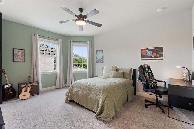1300 Morning Moon Cir, Austin, TX 78732 - bedroom with carpet floors, baseboards, a ceiling fan, and an office area