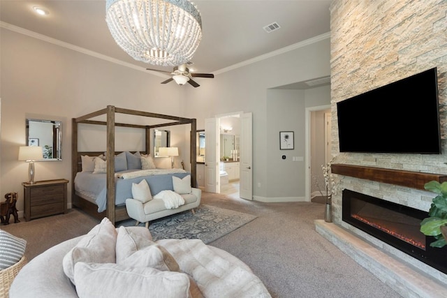 1300 Morning Moon Cir, Austin, TX 78732 - carpeted bedroom featuring a stone fireplace, crown molding, a chandelier, connected bathroom, and a ceiling fan
