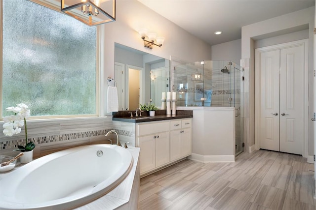 1300 Morning Moon Cir, Austin, TX 78732 - bathroom with vanity, a shower stall, a bath, and a chandelier