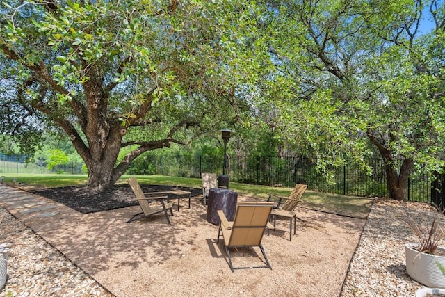 1300 Morning Moon Cir, Austin, TX 78732 - view of patio / terrace with a fire pit