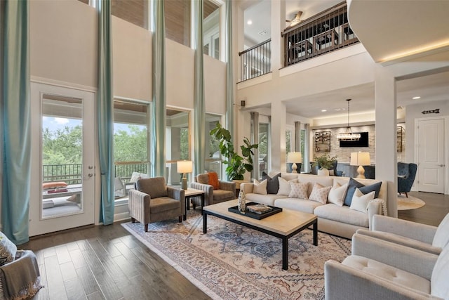 1300 Morning Moon Cir, Austin, TX 78732 - living room with a high ceiling and dark wood-style floors