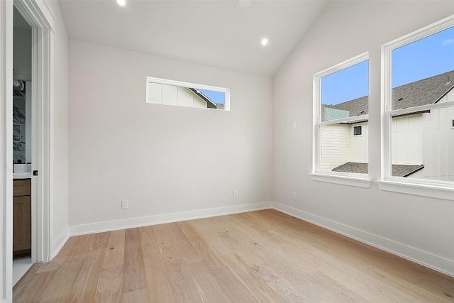 6309 Friendswood Dr, Austin, TX 78723 - spare room with light wood-type flooring, healthy amount of natural light, vaulted ceiling, and recessed lighting