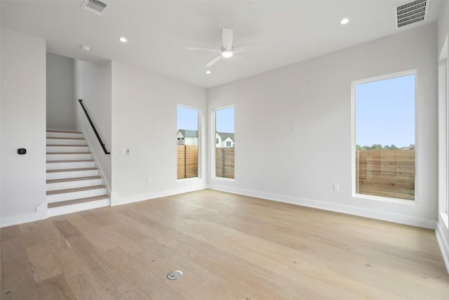 6309 Friendswood Dr, Austin, TX 78723 - unfurnished living room featuring stairs, light wood-style floors, ceiling fan, and recessed lighting
