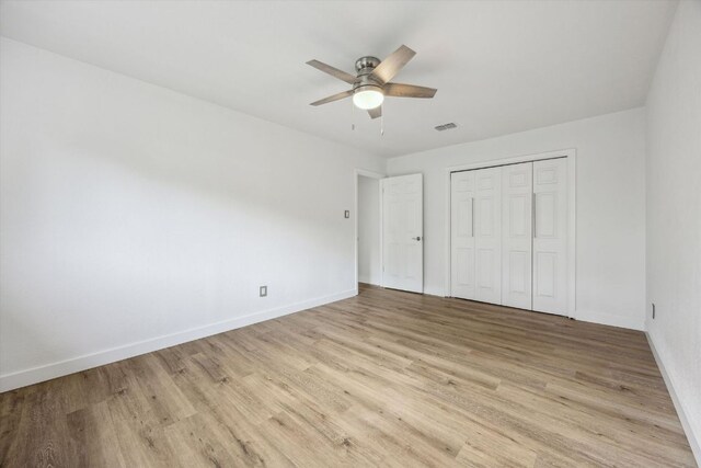 4525 Langtry Ln, Austin, TX 78749 - unfurnished bedroom with light wood-style flooring, a closet, and a ceiling fan