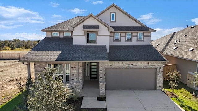 505 Golden Sage Ave, Georgetown, TX 78633 - view of front of house featuring concrete driveway, stucco siding, brick siding, and roof with shingles