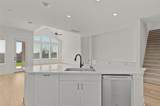 505 Golden Sage Ave, Georgetown, TX 78633 - kitchen with stainless steel dishwasher, light wood-type flooring, ceiling fan, light countertops, and recessed lighting