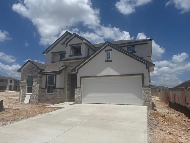 505 Golden Sage Ave, Georgetown, TX 78633 - view of front of house featuring stone siding, stucco siding, and driveway