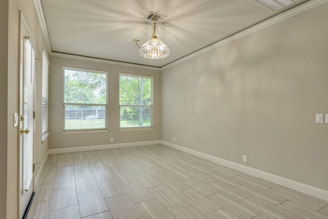 spare room with crown molding, a chandelier, and baseboards