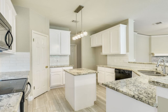 kitchen featuring a sink, black appliances, light stone countertops, decorative backsplash, and white cabinetry