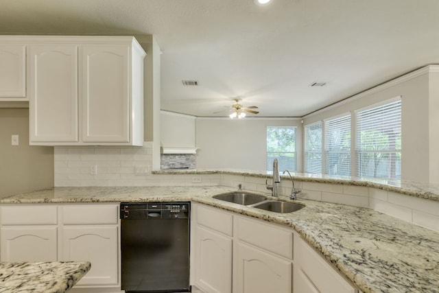 kitchen featuring dishwasher, a sink, a ceiling fan, decorative backsplash, and white cabinetry