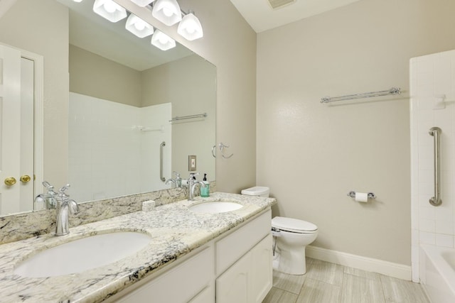 full bathroom featuring toilet, baseboards, double vanity, and bathing tub / shower combination