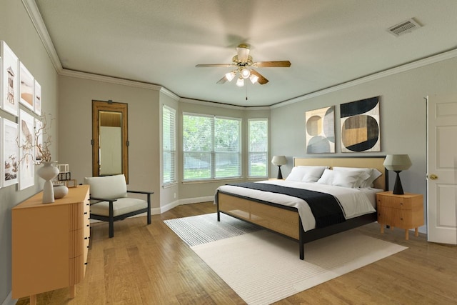 bedroom featuring light wood-type flooring, crown molding, baseboards, and ceiling fan
