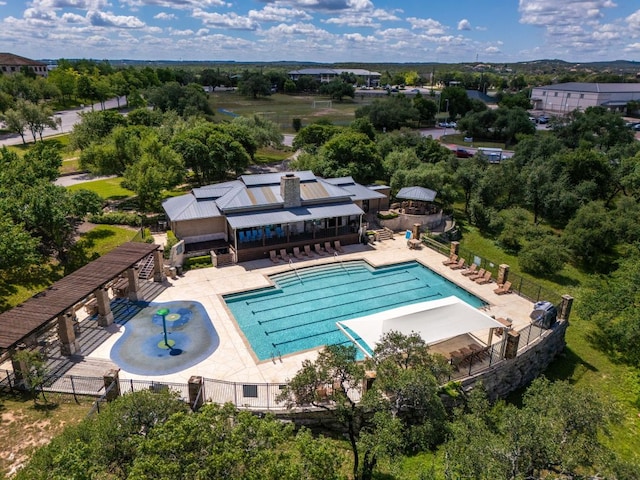 view of subject property featuring a pool
