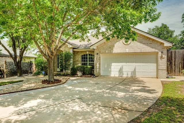 2601 Cascade Falls Dr, Austin, TX 78738 - view of front of house with brick siding, driveway, and an attached garage