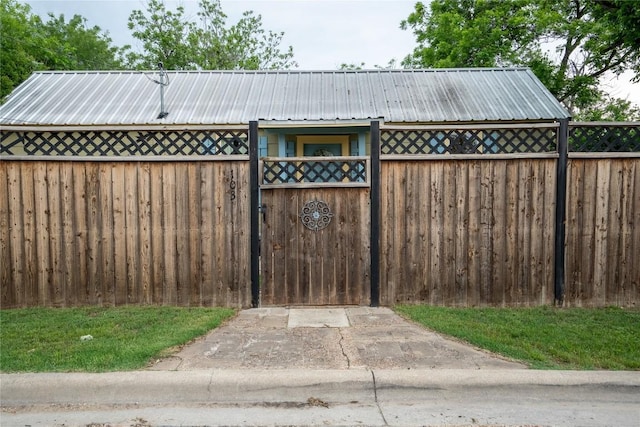 view of outdoor structure with a gate and fence