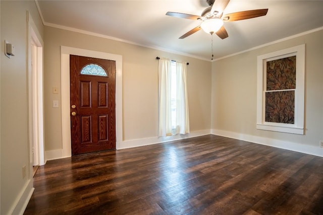foyer entrance with crown molding, baseboards, a ceiling fan, and dark wood finished floors