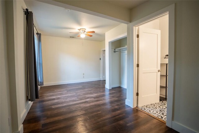 103 S Cornelius St, Thorndale, TX 76577 - spare room with a ceiling fan, dark wood finished floors, and baseboards