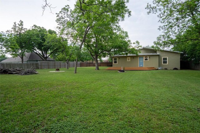 103 S Cornelius St, Thorndale, TX 76577 - view of yard featuring a wooden deck