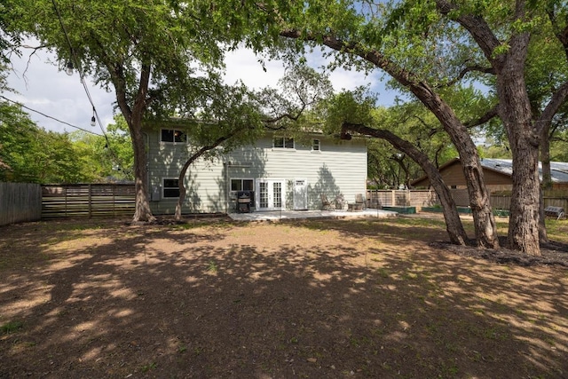 105 S Rainbow Bridge Dr, Cedar Park, TX 78613 - rear view of property with french doors and a fenced backyard