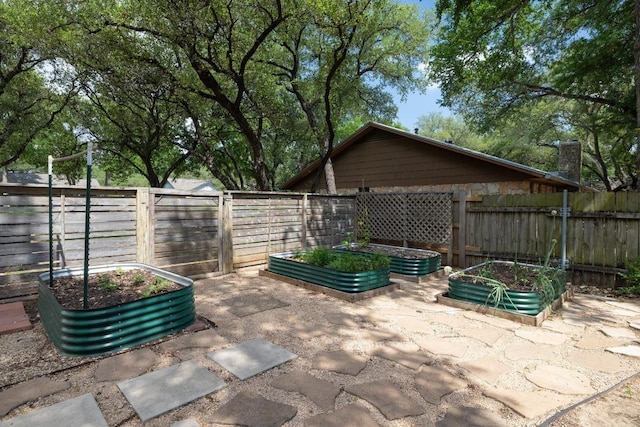 105 S Rainbow Bridge Dr, Cedar Park, TX 78613 - fenced backyard featuring a garden and a patio area