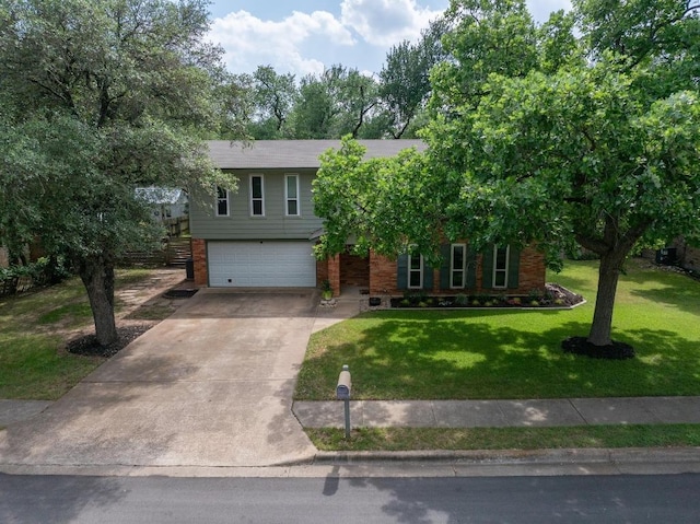 105 S Rainbow Bridge Dr, Cedar Park, TX 78613 - view of front of property featuring driveway, an attached garage, a front lawn, and brick siding