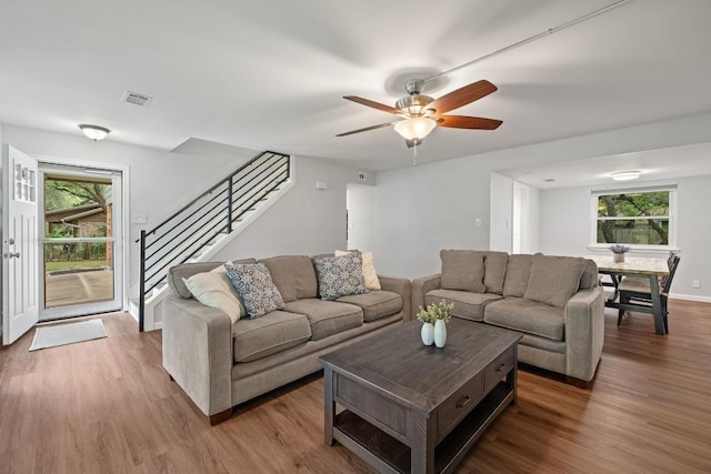 105 S Rainbow Bridge Dr, Cedar Park, TX 78613 - living area with wood finished floors, plenty of natural light, and stairway