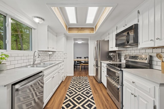105 S Rainbow Bridge Dr, Cedar Park, TX 78613 - kitchen with appliances with stainless steel finishes, white cabinetry, and light countertops