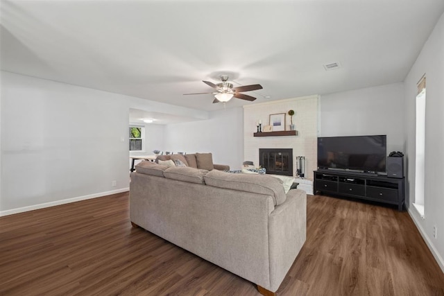105 S Rainbow Bridge Dr, Cedar Park, TX 78613 - living area featuring wood finished floors, a ceiling fan, and a brick fireplace