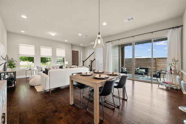 6800 Idea Rd, Austin, TX 78741 - dining room with visible vents, dark wood-style flooring, stairway, and recessed lighting