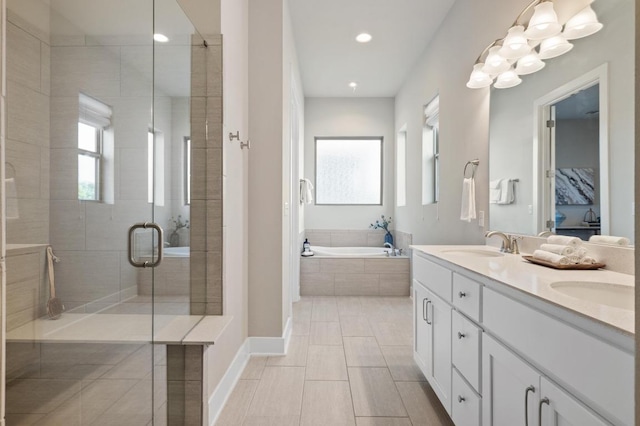 6800 Idea Rd, Austin, TX 78741 - bathroom with a sink, recessed lighting, a shower stall, double vanity, and a bath