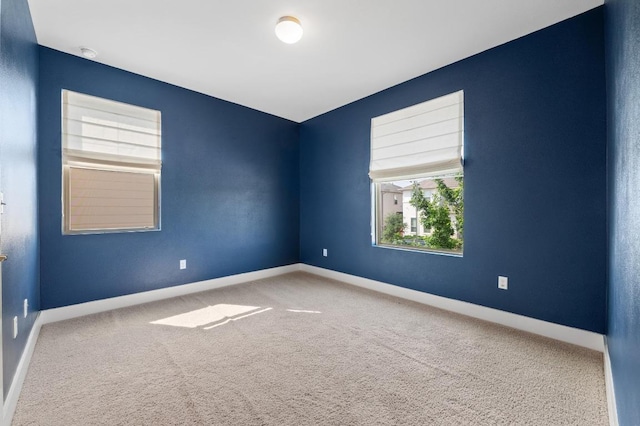 6800 Idea Rd, Austin, TX 78741 - carpeted spare room featuring baseboards