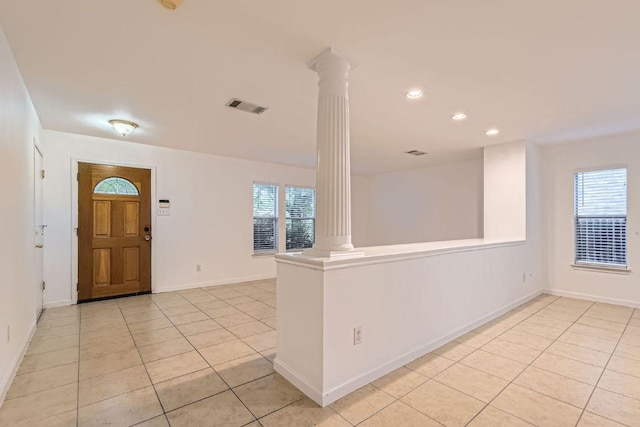 1171 Southern Pl, Round Rock, TX 78665 - entryway featuring decorative columns, light tile patterned flooring, and recessed lighting