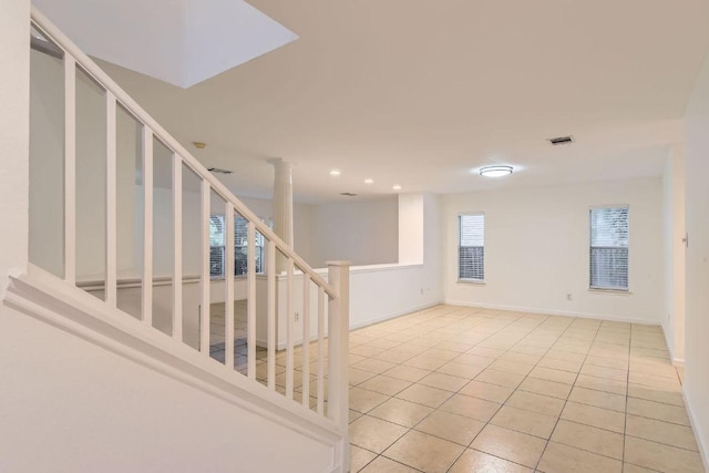 1171 Southern Pl, Round Rock, TX 78665 - empty room featuring light tile patterned floors, recessed lighting, stairway, and visible vents