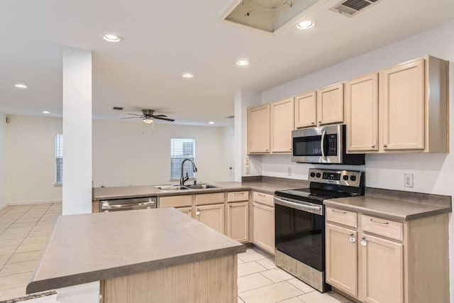 1171 Southern Pl, Round Rock, TX 78665 - kitchen featuring light tile patterned floors, stainless steel appliances, light brown cabinets, and a sink