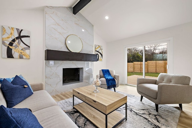 2927 Norwood Hill Rd, Austin, TX 78723 - living room with beam ceiling, wood finished floors, a premium fireplace, high vaulted ceiling, and recessed lighting