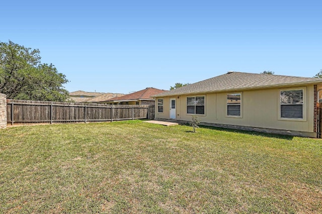 305 Bird Dog Bnd, Bastrop, TX 78602 - back of property with a patio