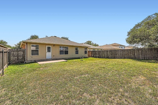 305 Bird Dog Bnd, Bastrop, TX 78602 - rear view of property with a patio area and stucco siding