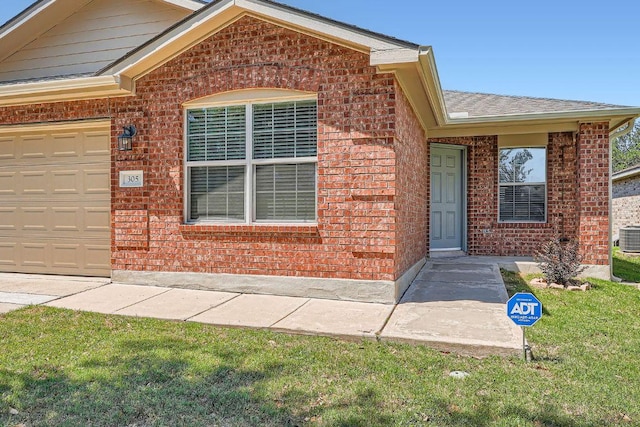305 Bird Dog Bnd, Bastrop, TX 78602 - entrance to property featuring brick siding, a shingled roof, a lawn, and central AC unit