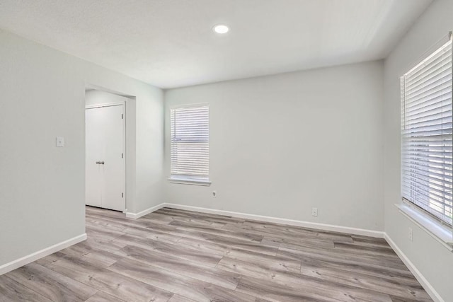 305 Bird Dog Bnd, Bastrop, TX 78602 - unfurnished room featuring wood finished floors, baseboards, and recessed lighting