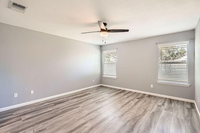 305 Bird Dog Bnd, Bastrop, TX 78602 - empty room featuring ceiling fan, wood finished floors, and baseboards
