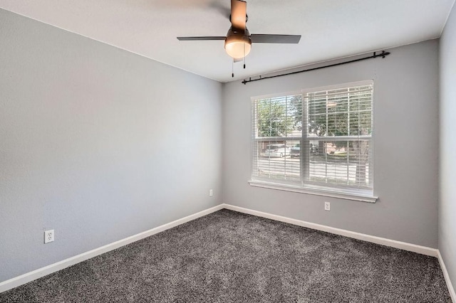 305 Bird Dog Bnd, Bastrop, TX 78602 - unfurnished room with dark carpet, baseboards, and a ceiling fan