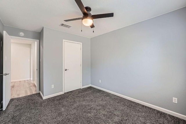 305 Bird Dog Bnd, Bastrop, TX 78602 - unfurnished bedroom with carpet, baseboards, and ceiling fan