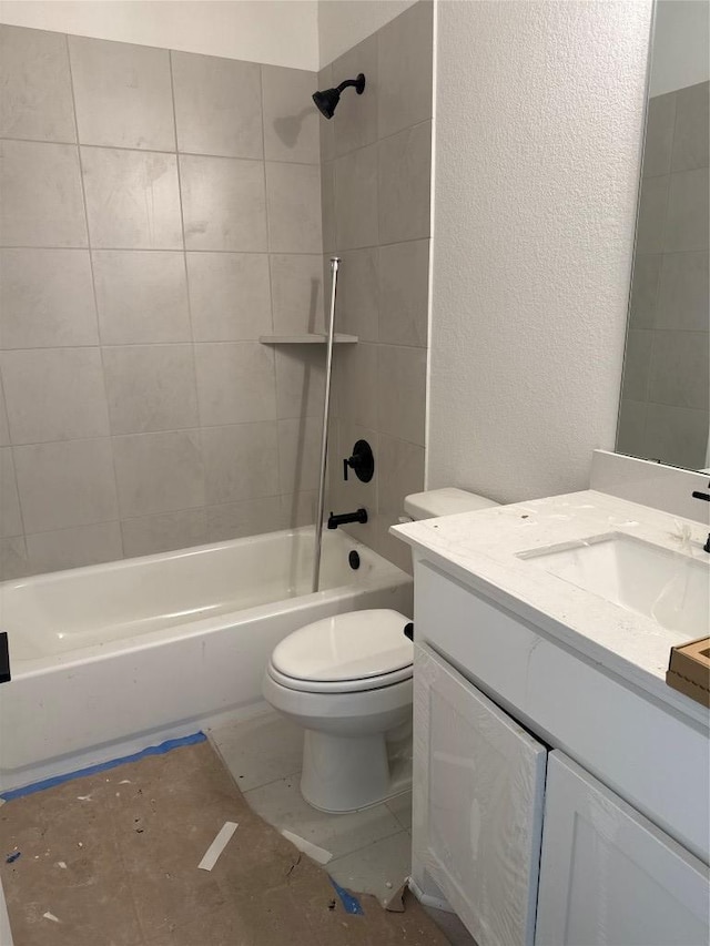 1033 Blanket Flower Dr, Georgetown, TX 78628 - full bathroom with vanity, toilet, a textured wall, and washtub / shower combination