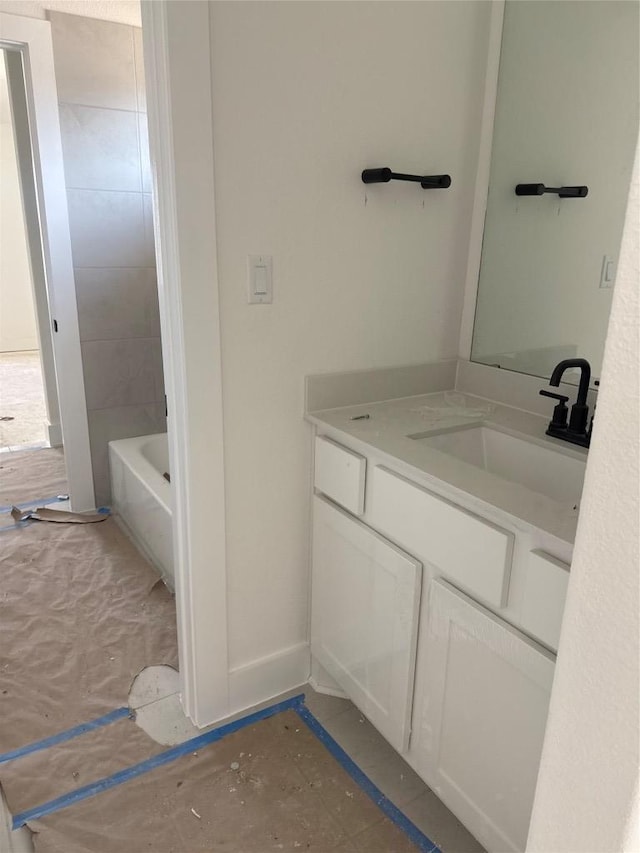 1033 Blanket Flower Dr, Georgetown, TX 78628 - bathroom featuring vanity and a washtub
