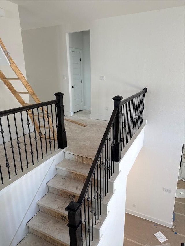 1033 Blanket Flower Dr, Georgetown, TX 78628 - staircase with baseboards