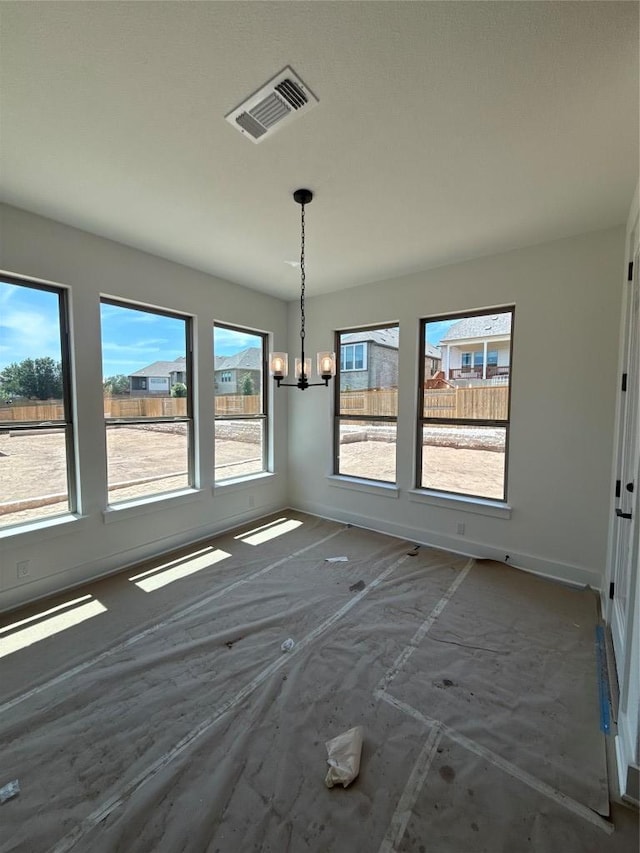 1033 Blanket Flower Dr, Georgetown, TX 78628 - unfurnished dining area with an inviting chandelier, visible vents, and a healthy amount of sunlight