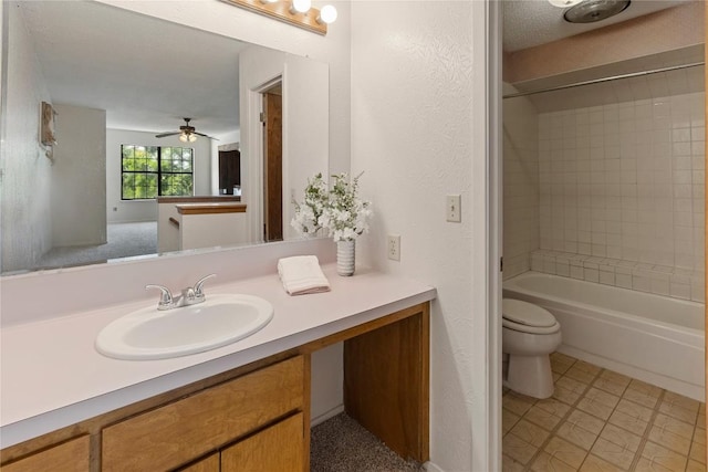 bathroom with toilet, bathing tub / shower combination, vanity, and ceiling fan
