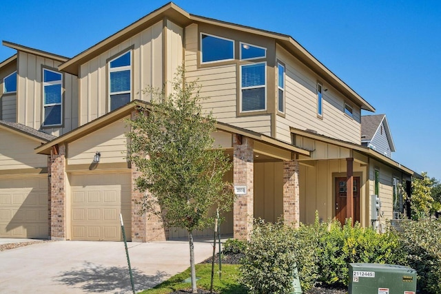 view of front of house with driveway, a garage, and board and batten siding