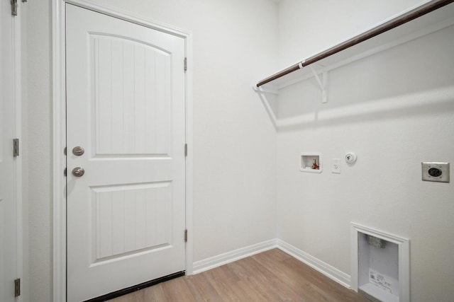 washroom with wood finished floors, electric dryer hookup, laundry area, washer hookup, and hookup for a gas dryer