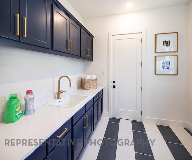 interior space with recessed lighting, light tile patterned floors, baseboards, and a sink